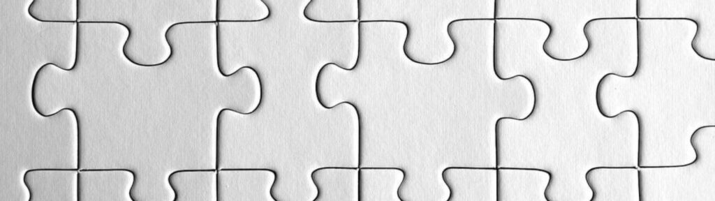 Blank white puzzle pieces connected together